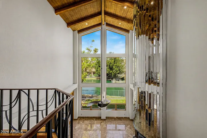 Six oversized Pella Fixed Picture Windows perfectly framing stunning Lake and Mountain Views