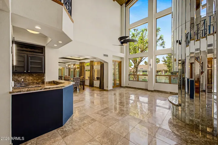 Refinished cabinetry with updated hardware, soft-close hinges and recessed LED Lighting| Pocket Door | Recessed accent lighting integrated beneath the bar countertop