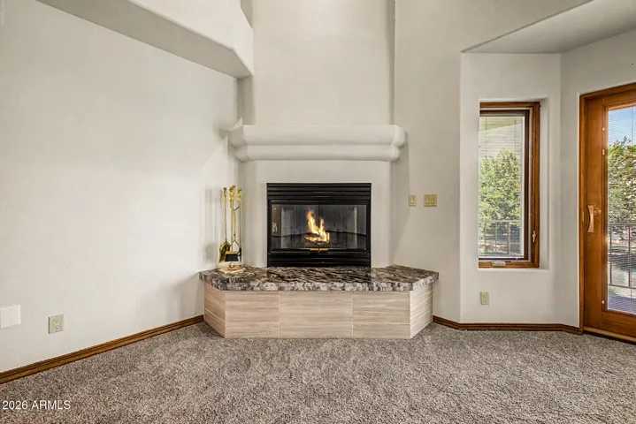 Cozy Wood-Burning Fireplace w/Custom Mantle and Granite Seating Bench