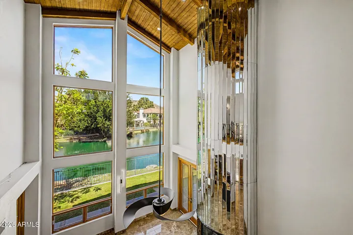 Dramatic Mirrored Floor-to-Ceiling Wood-Burning Fireplace