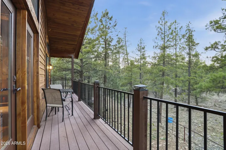 This long deck off the upstairs rec room overlooks the national forest.