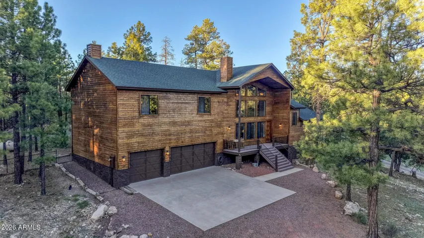Nestled on over 1 acre against National Forest Land