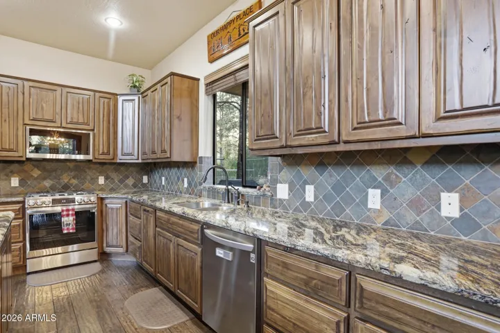 Stainless steel appliances with Gas Stove. Granite, of course!