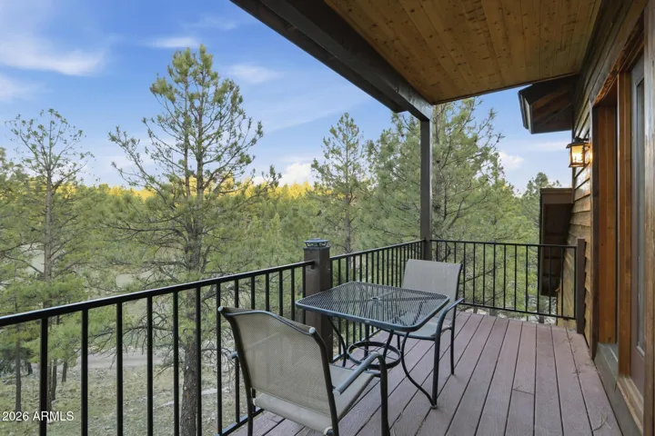This deck off the two bedrooms upstairs is on the East side for those beautiful forest sunrises