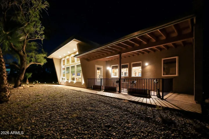 Front of home and covered patio in evening