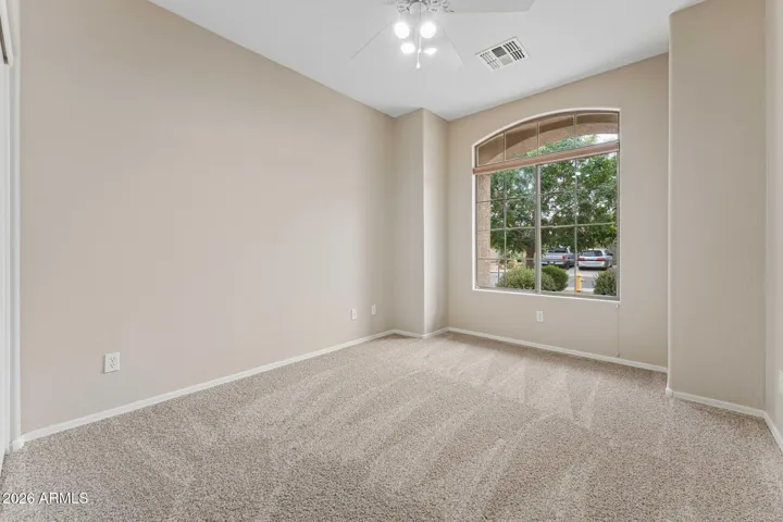 Bedroom 1 with large picture window to the front patio.