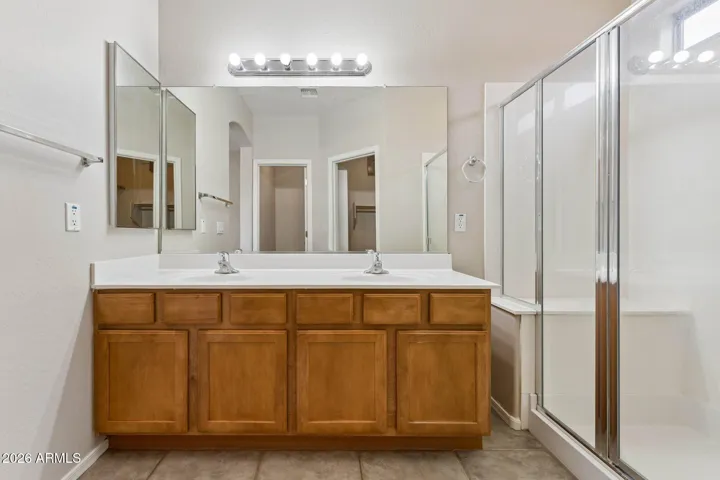 Master bathroom with double sinks, walkin shower with seat