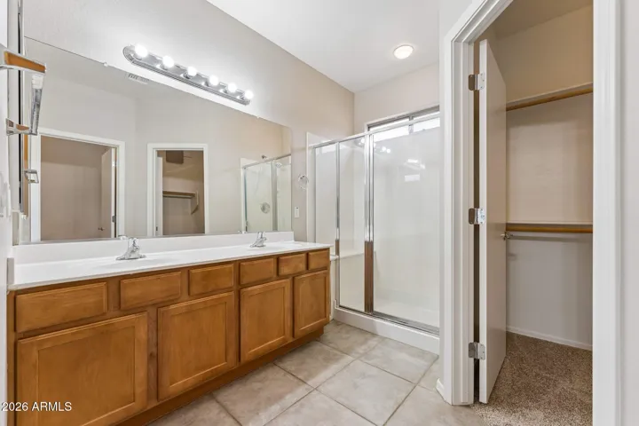 Master bathroom with walk-in closet, double sinks