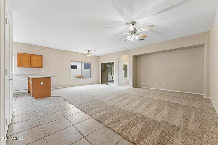 Fresh paint and brand new carpet welcomes you in this large family room and kitchen area.