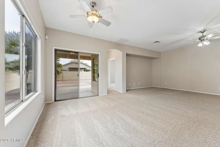 Large dining and family room with patio door to covered patio