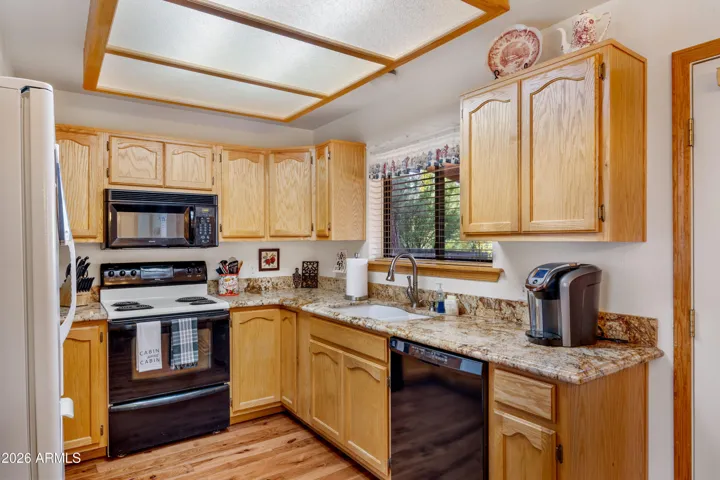 Functional kitchen with granite counters with all appliances conveying
