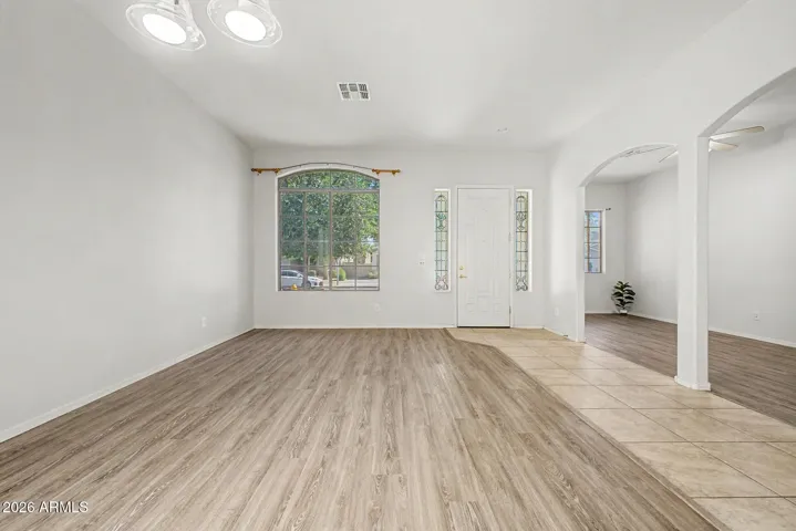 Front entry, formal living/dining and a custom built office/den area