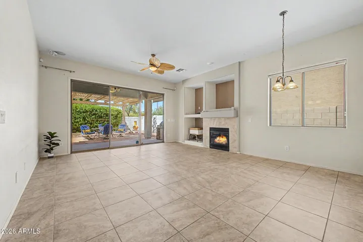 Family Room with LARGE Slider to back yard & Built in Fireplace