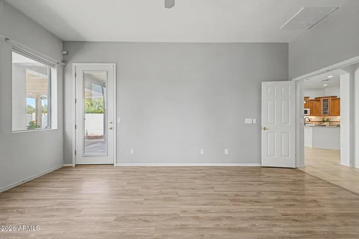 Primary Suite showing exit to back yard and entry from Family Room