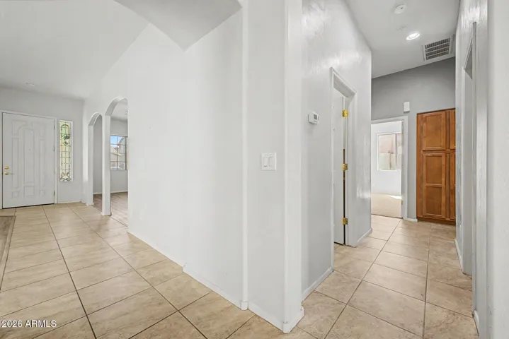 Hallway view showing front door, hallway to bedrooms 2 & 3, bathroom and laundry room