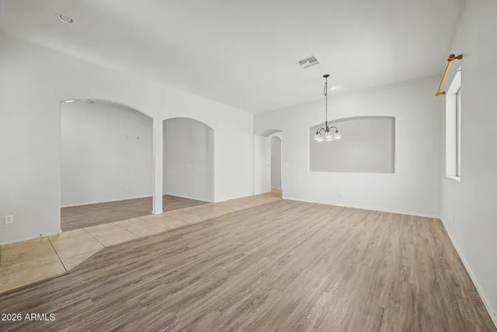 View of formal dining and office/den area with beautiful archways!