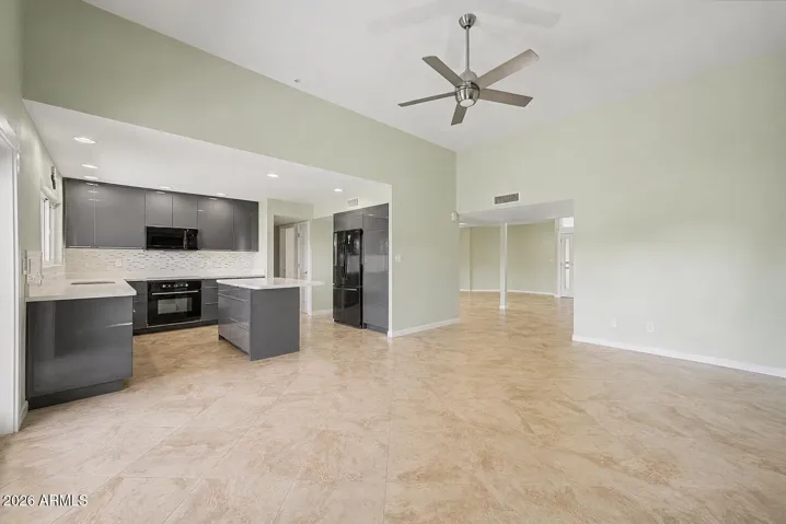 LIVING ROOM + OPEN KITCHEN VIRTUALLY DE-STAGED