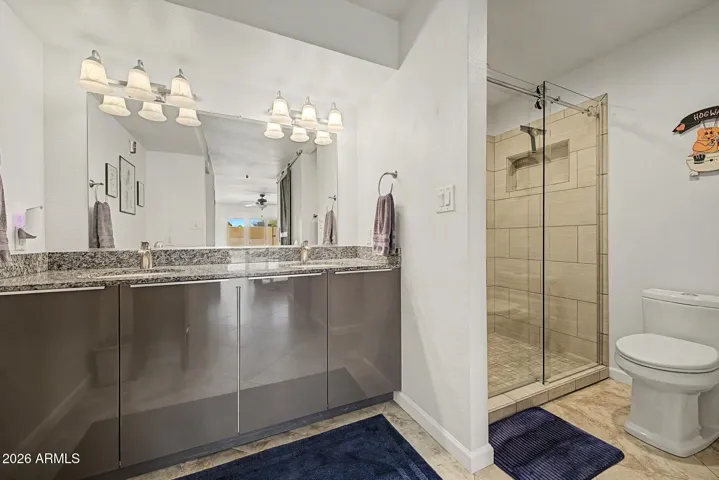 PRIMARY BATH DUAL VANITY + TILE SHOWER