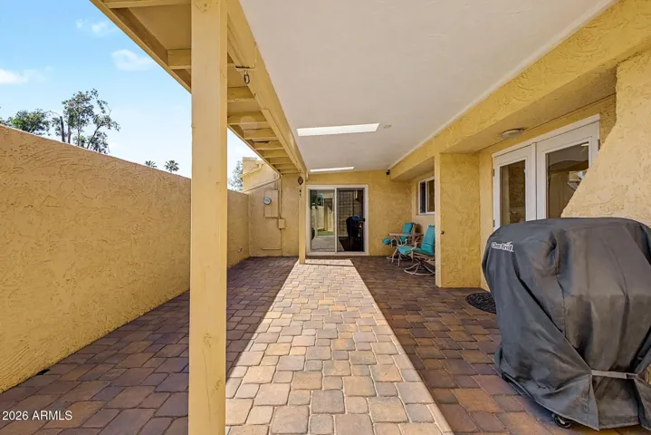 EXTENDED COVERED PATIO + PAVERS