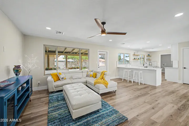 Seamless open-concept layout connecting the living room and kitchen, perfect for everyday living and entertaining guests.