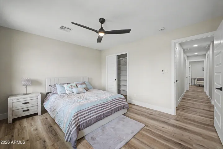 Comfortable guest bedroom with contemporary finishes, updated flooring, and easy access to the main living areas.