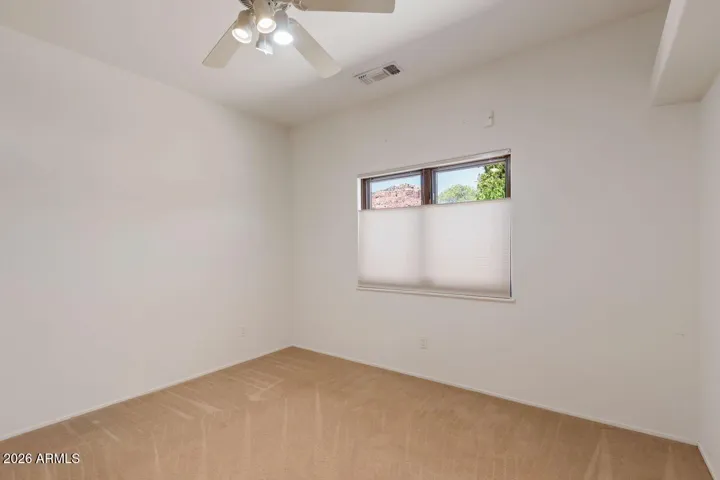 Third bedroom with closet and red rock views