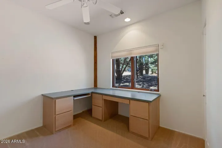 Second bedroom with built in desk and closet