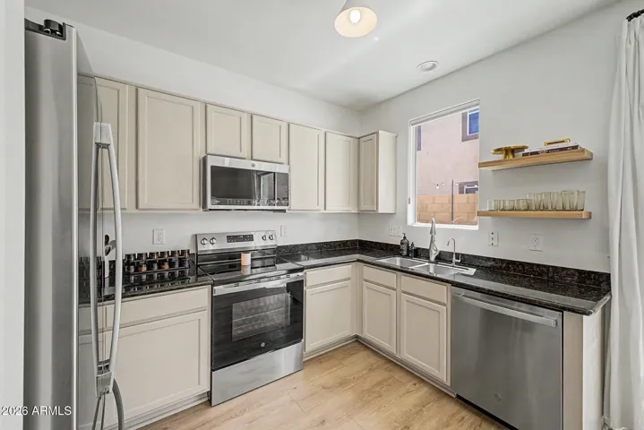 Kitchen with stainless steel appliance - all convey