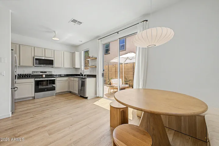 Kitchen with stainless steel appliance - all convey