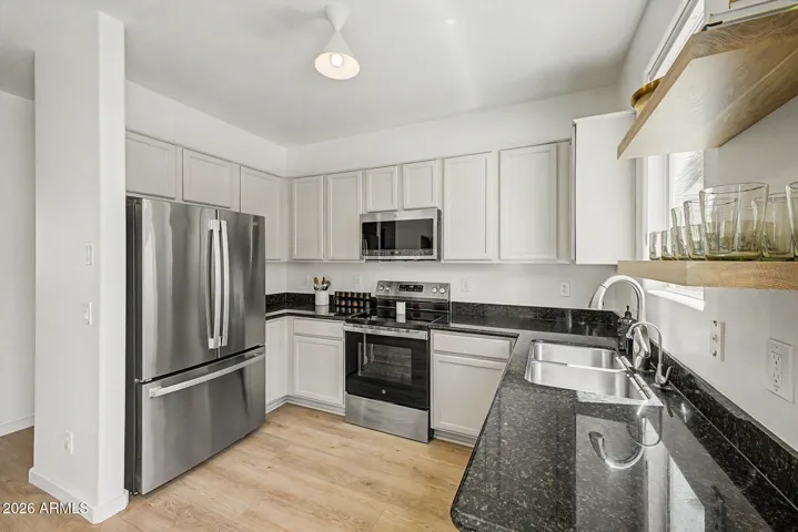 Kitchen with stainless steel appliance - all convey