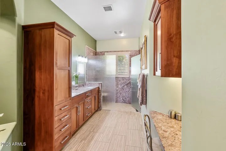 Completely remodeled and thoughtfully designed, featuring a spacious walk-in two-person shower with a wheelchair accessible, barrier-free entry—ideal for comfort, ease, and long-term livability.