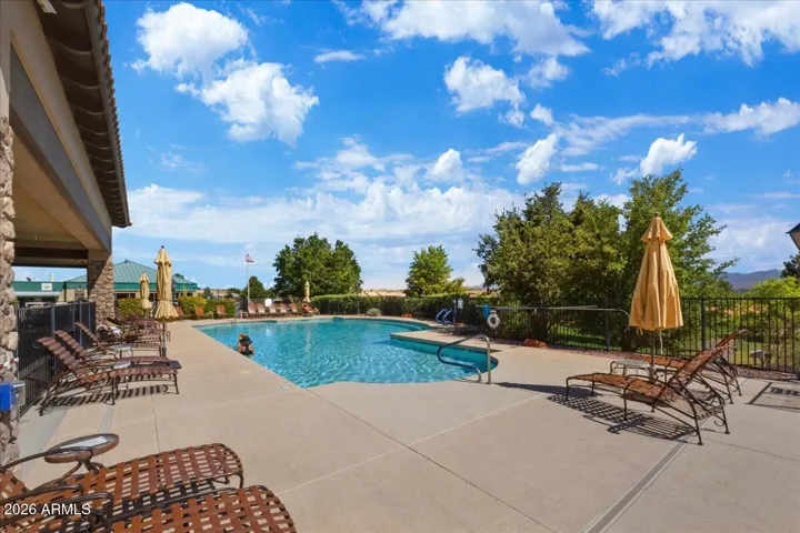 Clubhouse membership includes access to a resort-style pool, offering a refreshing escape for swimming, lounging, and soaking in the relaxed rhythm of Verde Santa Fe living.