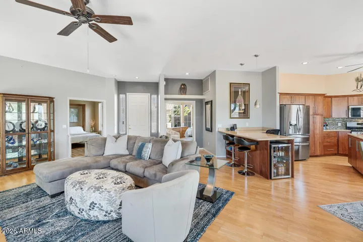 The living area transitions seamlessly into the kitchen and dining spaces, creating an easy, connected layout ideal for both everyday living and entertaining.
