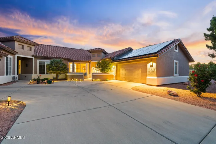 At dusk, the home radiates a quiet beauty—inviting, grounded, and unmistakably yours.
