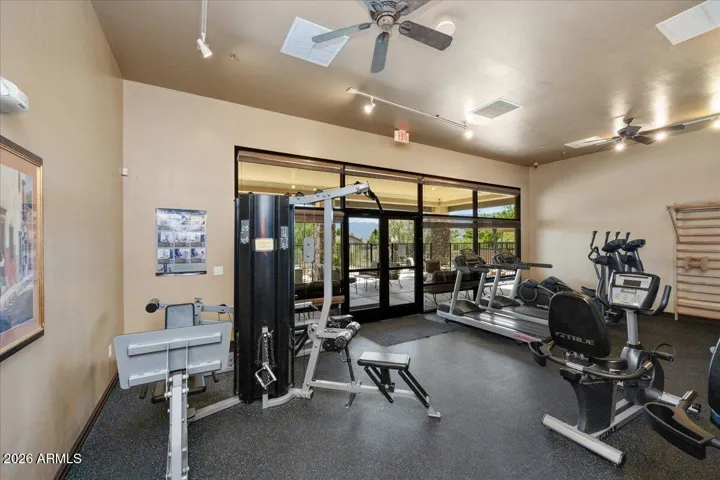 Clubhouse membership includes access to a well-equipped fitness center, offering a bright, comfortable space with weights and cardio machines for strength training and everyday wellness.