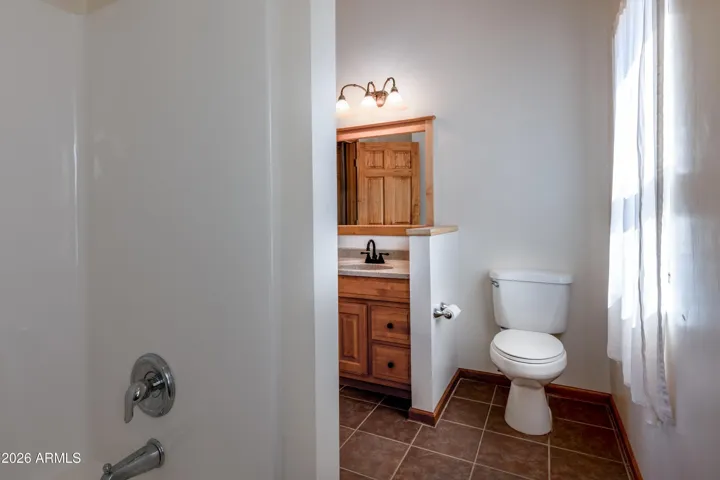 Bathroom with shower in tub.