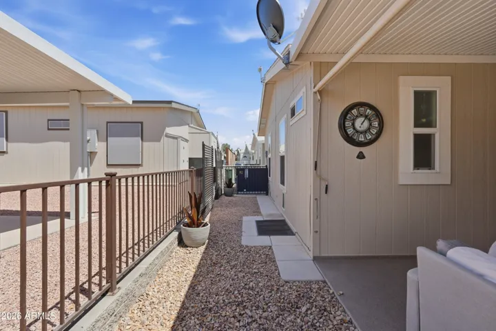 Fenced back yard with doggy door