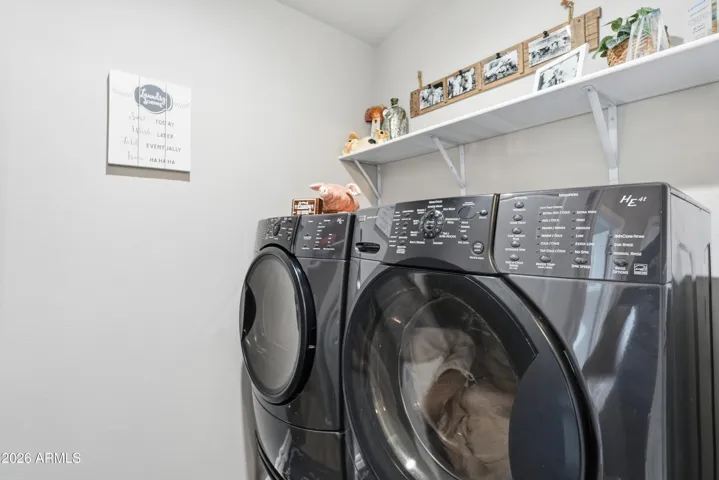 Spacious Laundry Room with front loading machine set