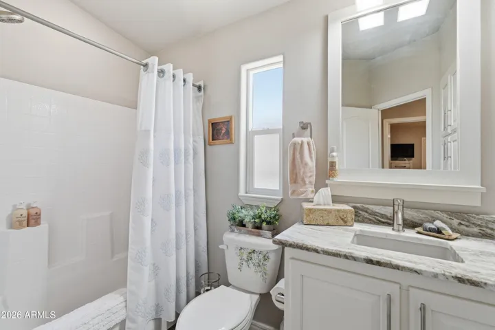 Granite raised vanity in guest bath