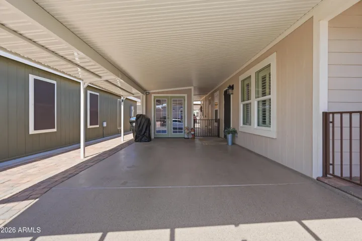 Epoxy driveway with pavered extended patio