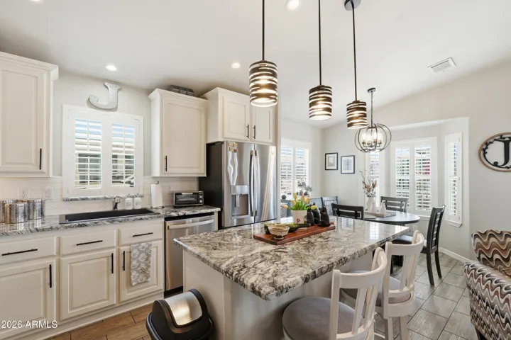 Staggered cabinetry with sleek hardware and soft-close cabinets.