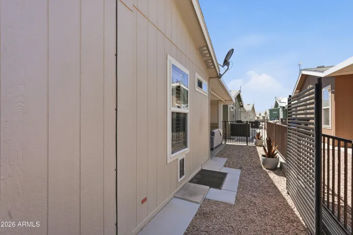Fenced back yard with doggy door