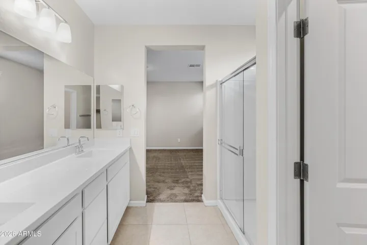 OWNER'S PRIVATE EN-SUITE LOOKING TOWARDS THE BEDROOM WITH LARGE SHOWER