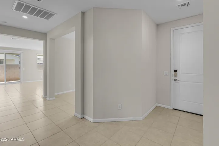 LOOKING AT FRONT DOOR & FLEX ROOM ENTRY