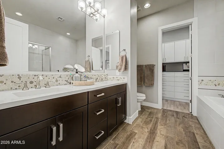 Master Bathroom with fully tiles walls (to ceiling) in vanity and shower area.