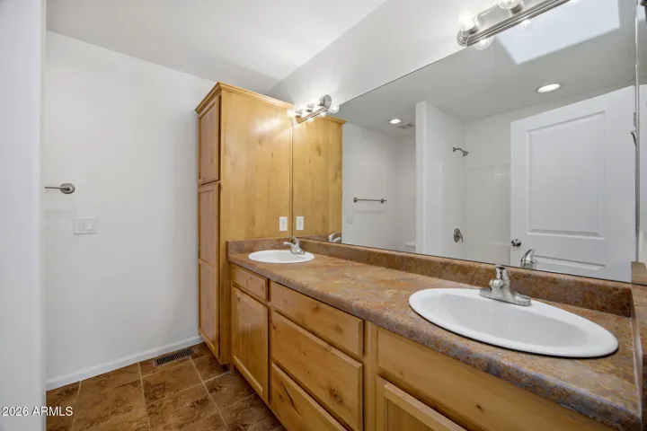 Master bathroom dual vanities with new plumbing fixtures