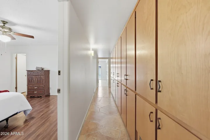 hallway from primary to bonus/4th bedroom