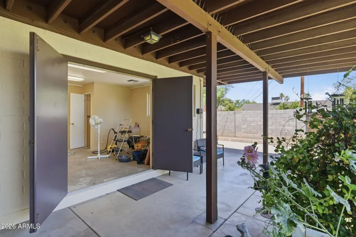 rear patio and opening to another room