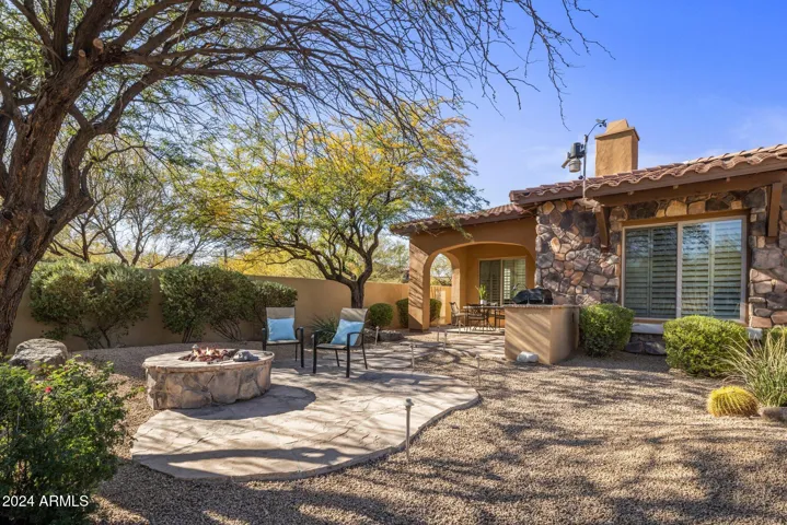 With fire pit, built in BBQ, & spacious covered patio, with no neighbors behind or to the side of property