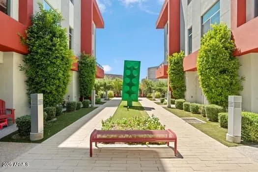 Inviting courtyard area with clean walkways, greenery, and a thoughtfully designed community setting.